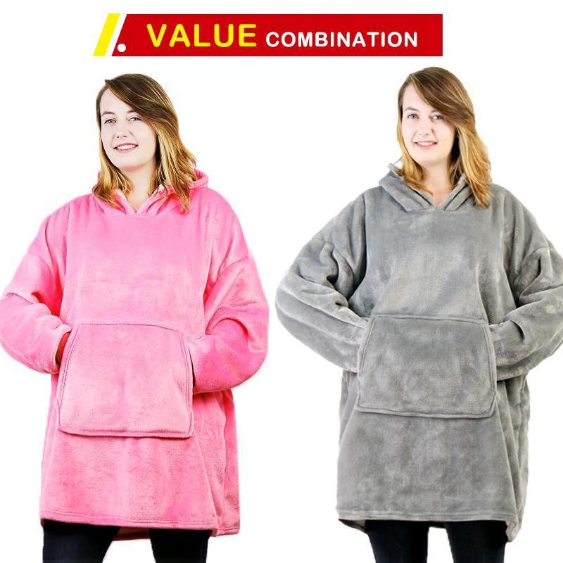 Someone relaxing on a couch, wrapped in a cozy wearable blanket sweatshirt, looking comfortable