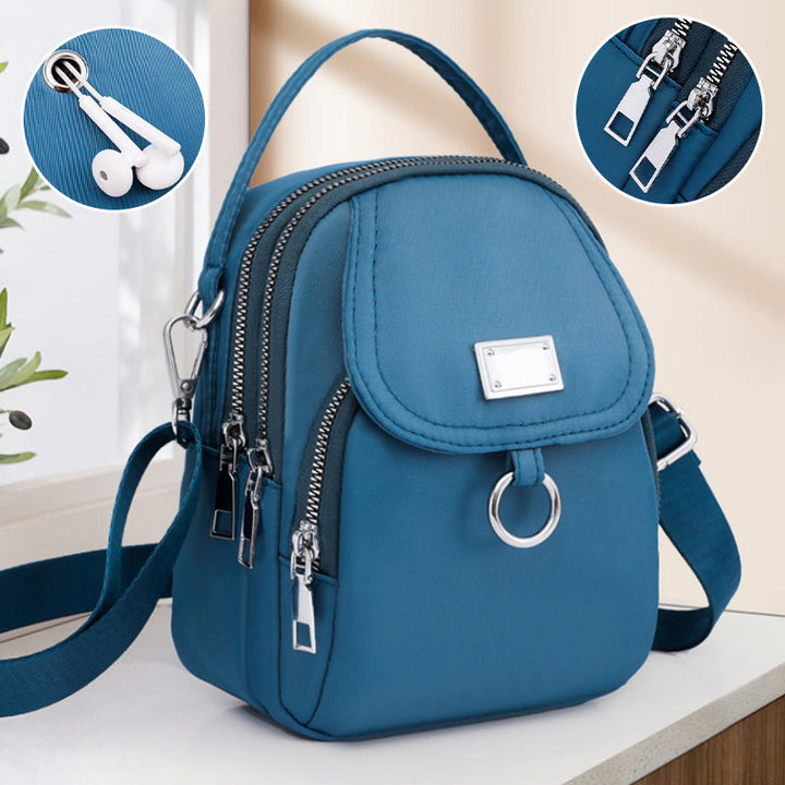 Back view of functional nylon travel bag, showcasing comfortable adjustable strap