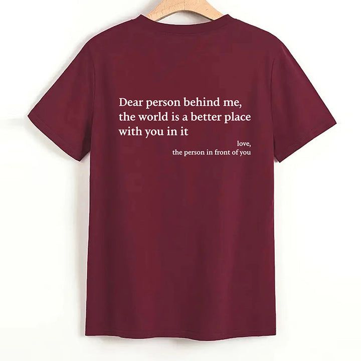 Model gesturing confidently in the 'You Are Enough' inspirational cotton top.