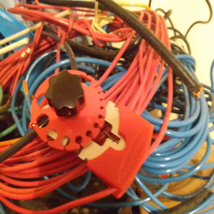 Detailed view of a versatile hand tool for stripping wires, featuring durable construction and easy use