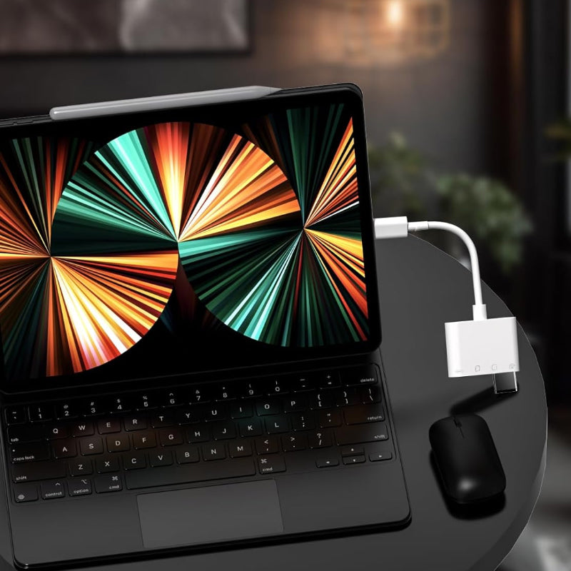 Universal mobile memory card reader with a laptop and smartphone, displaying its versatility in data management