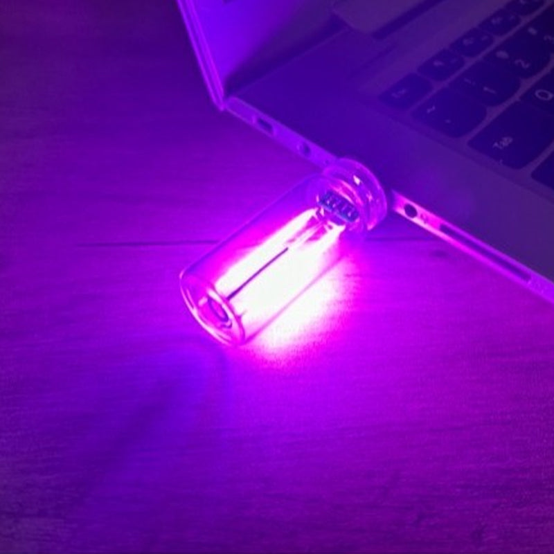 Compact and portable USB night light, touch interface for brightness control, white color.