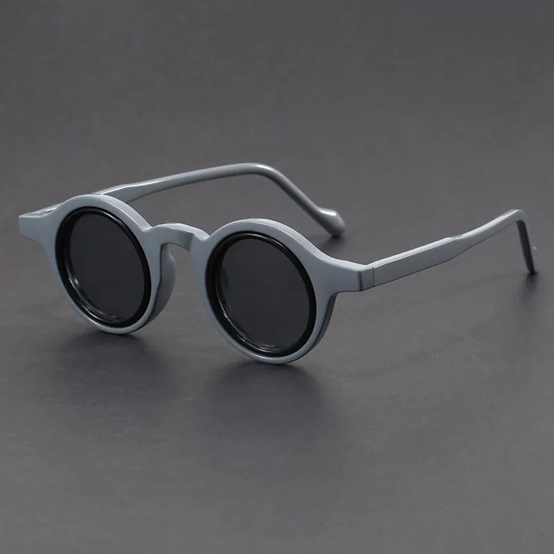 Velari unisex round frame sunglasses with matte black finish, a modern fashion accessory for all genders.