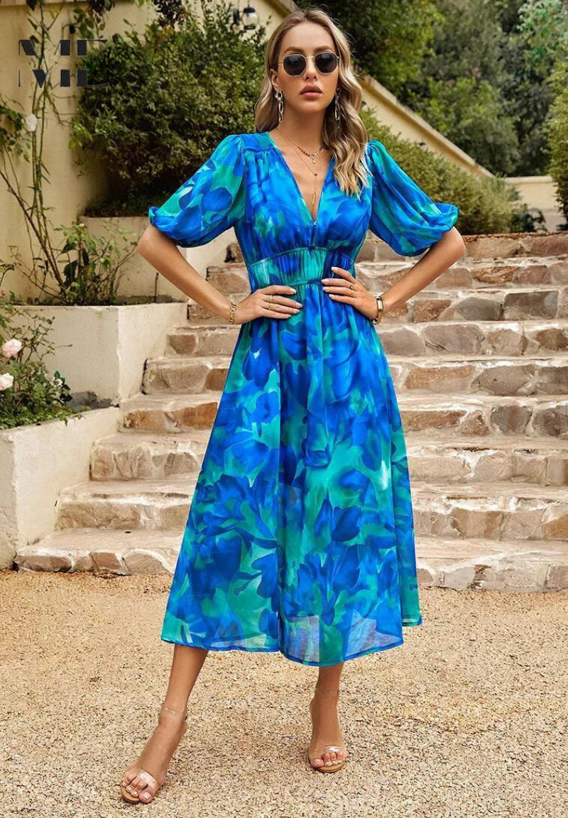 Stunning women's floral A-line midi dress with short sleeves, showcasing its elegant and flowy design.