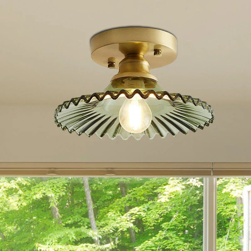 Vintage-inspired semi-flush ceiling lamp with ribbed green glass shade, ideal for classic or modern interiors.
