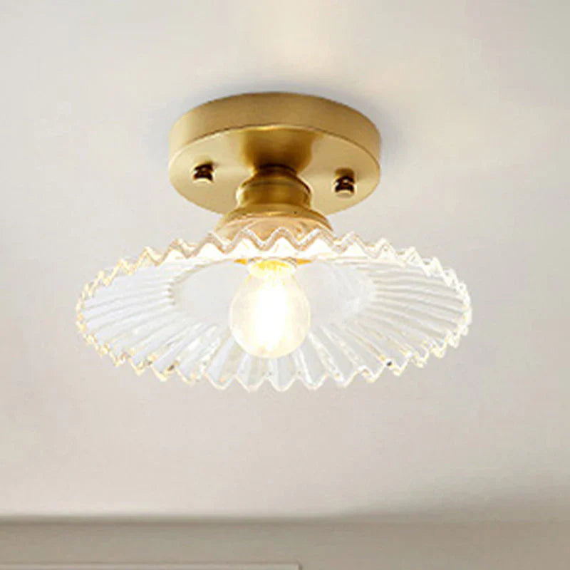 Vintage-inspired semi-flush ceiling lamp with ribbed green glass shade, ideal for classic or modern interiors.