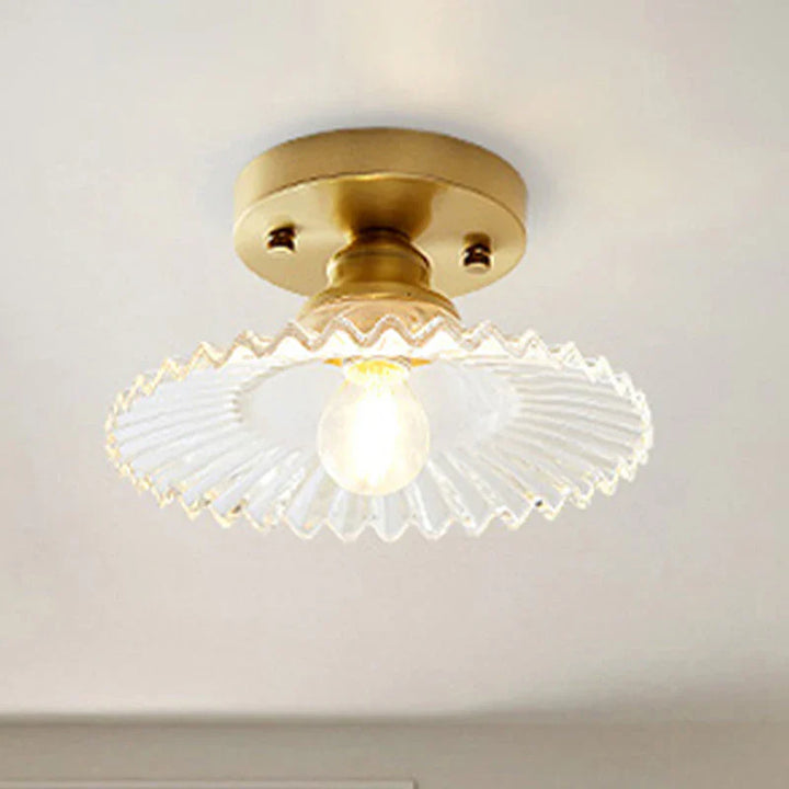 Vintage-inspired semi-flush ceiling lamp with ribbed green glass shade, ideal for classic or modern interiors.