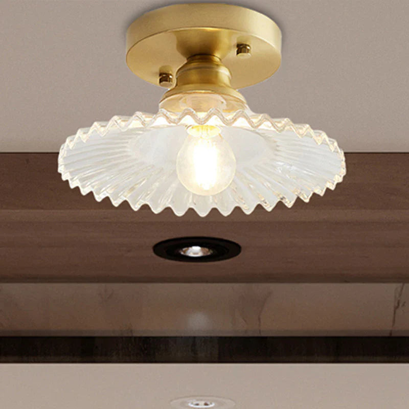 Vintage-inspired semi-flush ceiling lamp with ribbed green glass shade, ideal for classic or modern interiors.