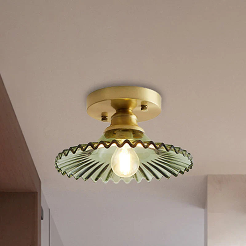 Vintage-inspired semi-flush ceiling lamp with ribbed green glass shade, ideal for classic or modern interiors.
