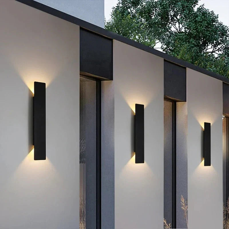 Weatherproof LED wall light with sleek aluminum design, ideal for enhancing outdoor spaces like patios and gardens.