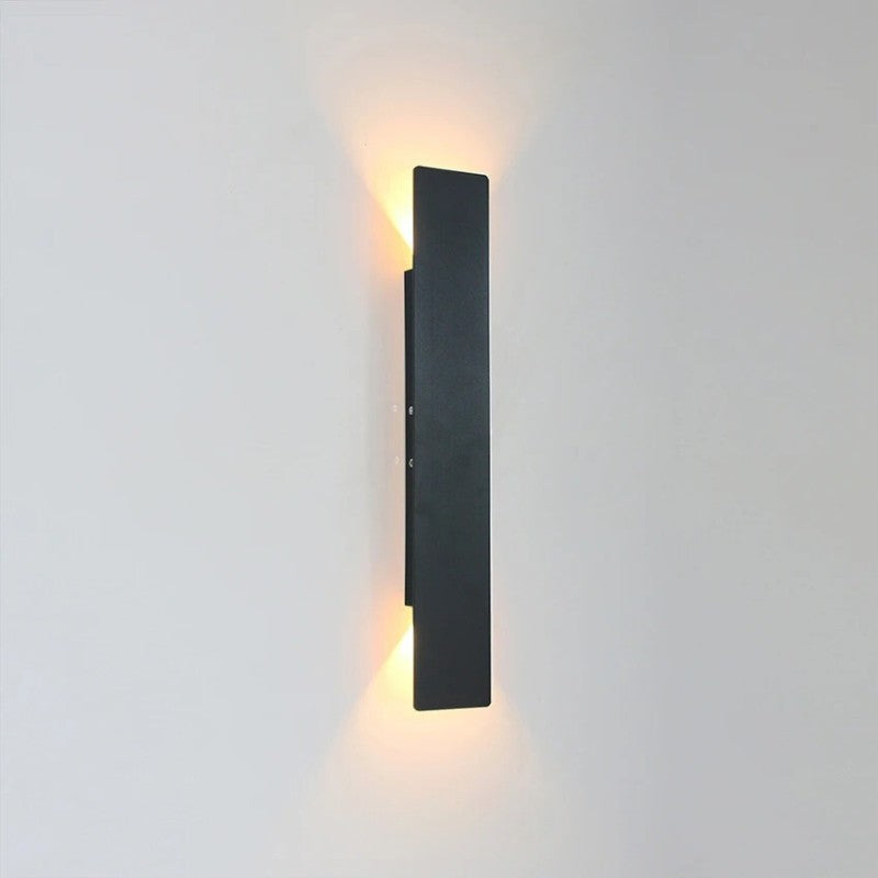 Weatherproof LED wall light with sleek aluminum design, ideal for enhancing outdoor spaces like patios and gardens.