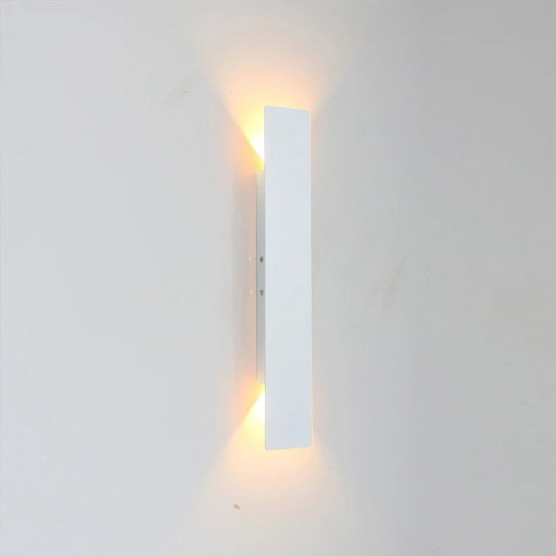 Weatherproof LED wall light with sleek aluminum design, ideal for enhancing outdoor spaces like patios and gardens.
