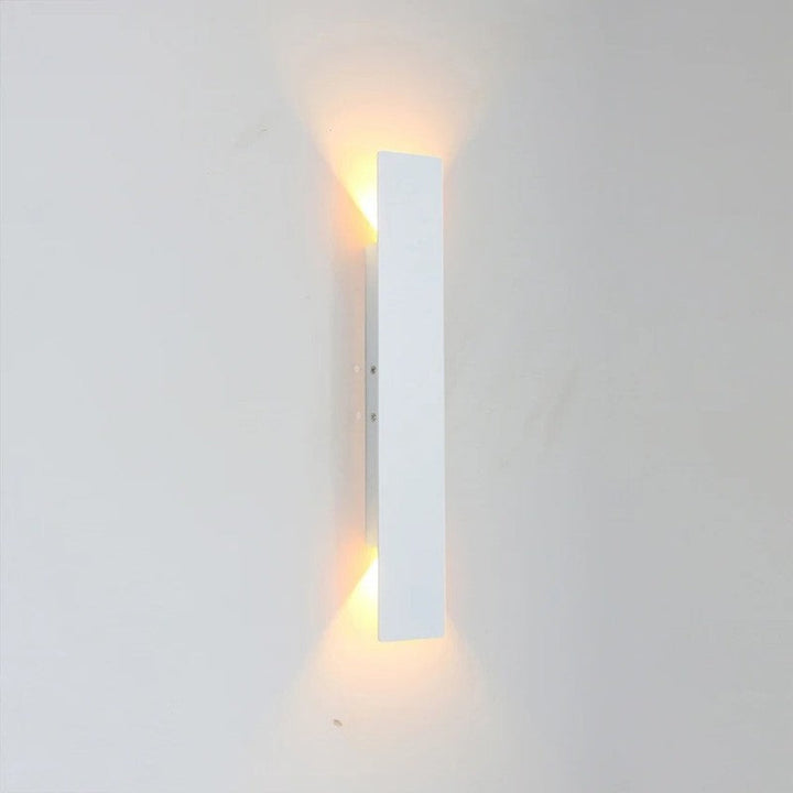 Weatherproof LED wall light with sleek aluminum design, ideal for enhancing outdoor spaces like patios and gardens.