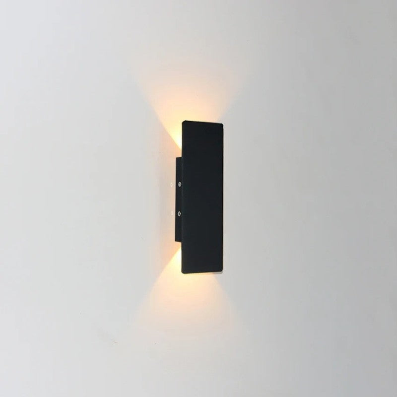 Weatherproof LED wall light with sleek aluminum design, ideal for enhancing outdoor spaces like patios and gardens.