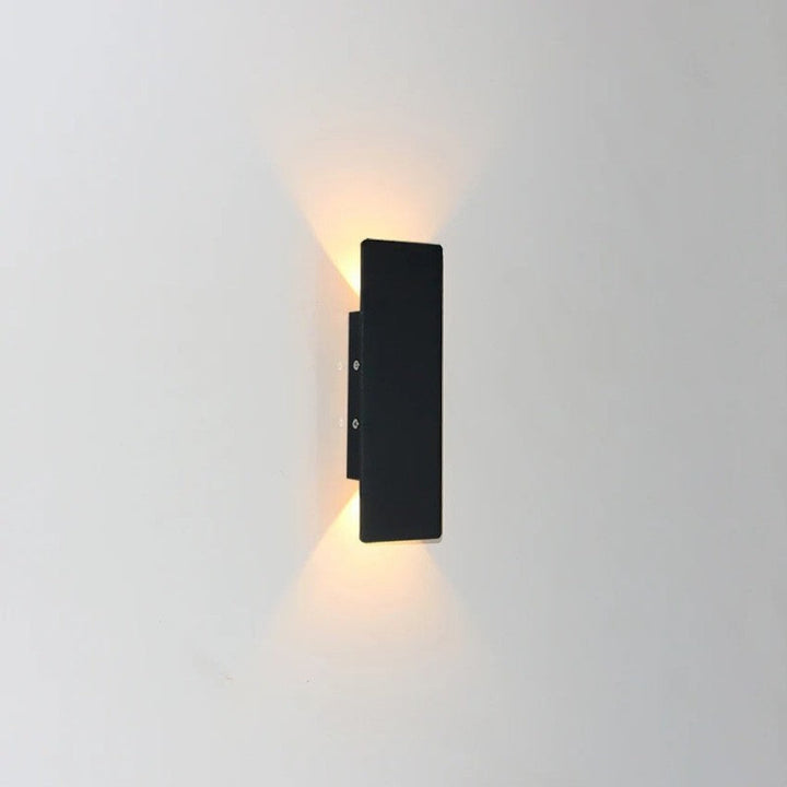 Weatherproof LED wall light with sleek aluminum design, ideal for enhancing outdoor spaces like patios and gardens.