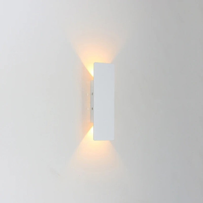 Weatherproof LED wall light with sleek aluminum design, ideal for enhancing outdoor spaces like patios and gardens.