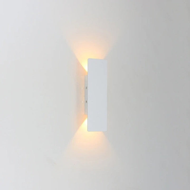 Weatherproof LED wall light with sleek aluminum design, ideal for enhancing outdoor spaces like patios and gardens.