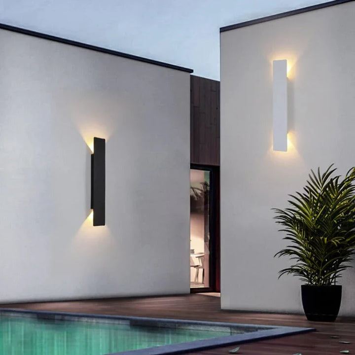 Weatherproof LED wall light with sleek aluminum design, ideal for enhancing outdoor spaces like patios and gardens.
