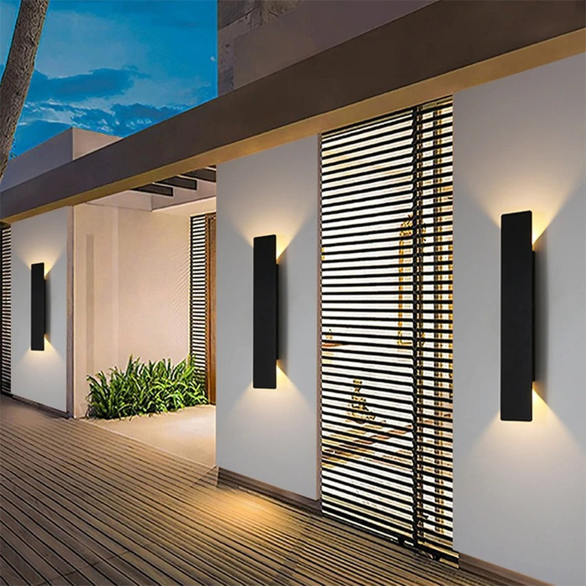 Weatherproof LED wall light with sleek aluminum design, ideal for enhancing outdoor spaces like patios and gardens.
