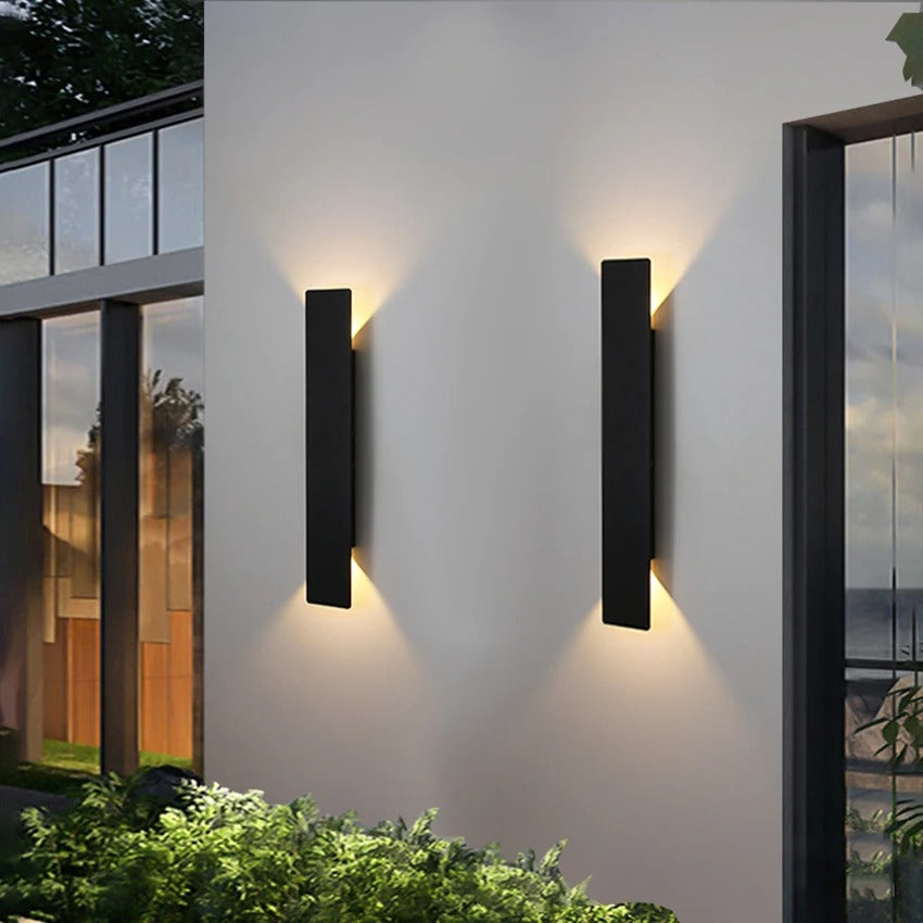 Weatherproof LED wall light with sleek aluminum design, ideal for enhancing outdoor spaces like patios and gardens.