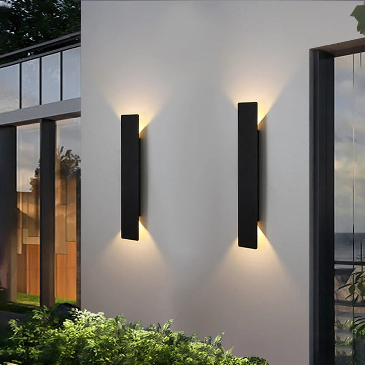 Weatherproof LED wall light with sleek aluminum design, ideal for enhancing outdoor spaces like patios and gardens.