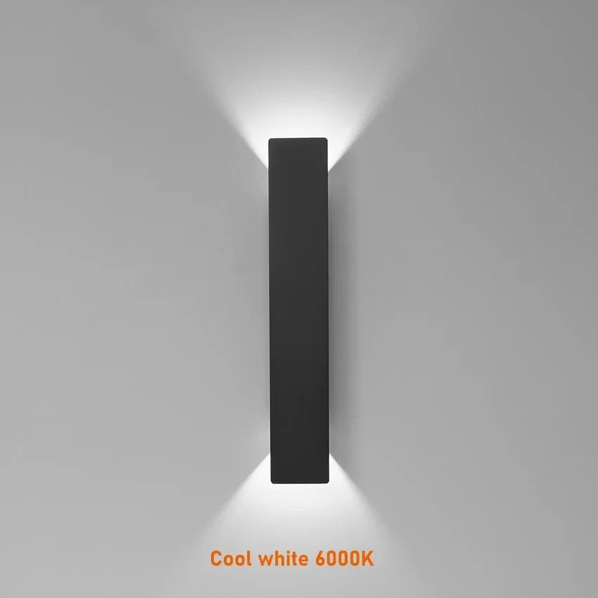 Weatherproof LED wall light with sleek aluminum design, ideal for enhancing outdoor spaces like patios and gardens.