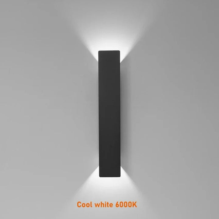 Weatherproof LED wall light with sleek aluminum design, ideal for enhancing outdoor spaces like patios and gardens.