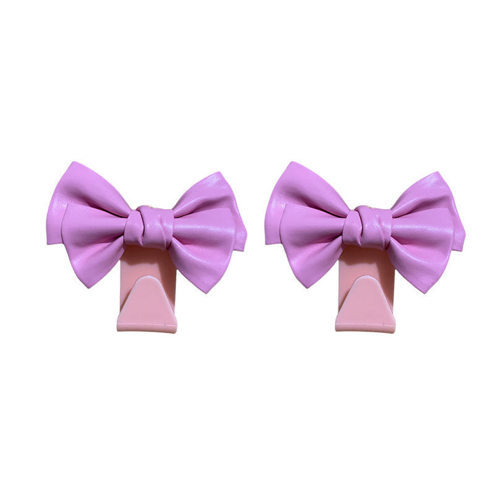 Durable plastic bowknot car seat back hooks, essential car accessories for storage