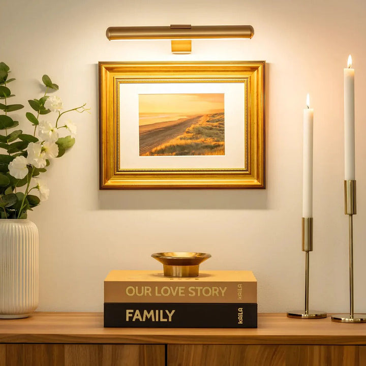 Sleek LED picture light illuminating framed art. Wireless, rechargeable & dimmable for perfect art display.