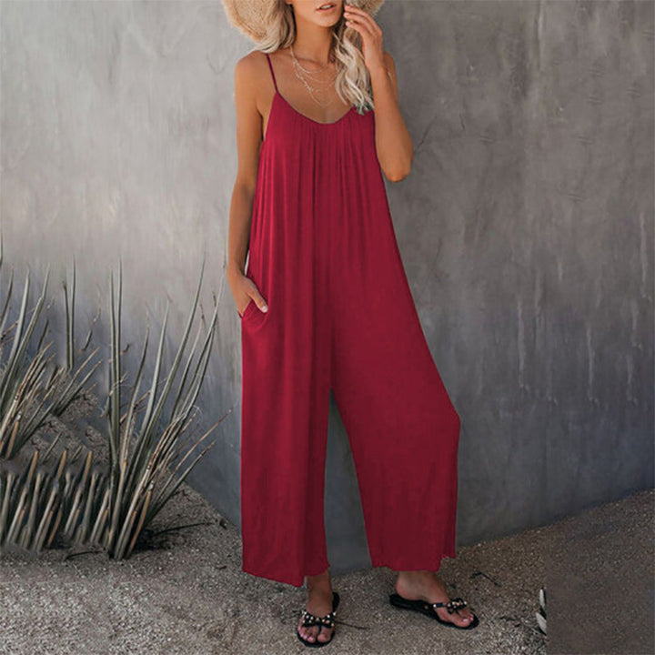 Fashionable woman walking in a solid colored sleeveless jumpsuit, perfect casual wear summer outfit