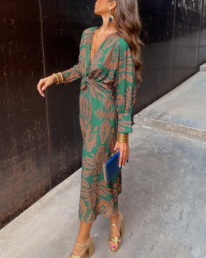 Printed A-line maxi dress for women, perfect as a wedding guest or formal cocktail dress, featuring knot detail.