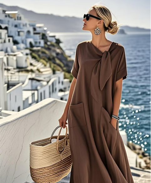 Stylish women's A-line casual midi dress with short sleeves & pockets, great for comfortable summer & everyday wear.