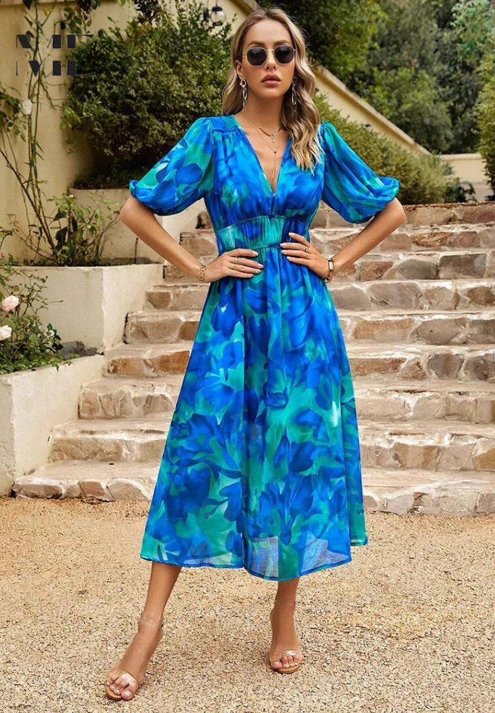 Fashionable women's abstract print midi dress with a self-tie belt, embodying spring style