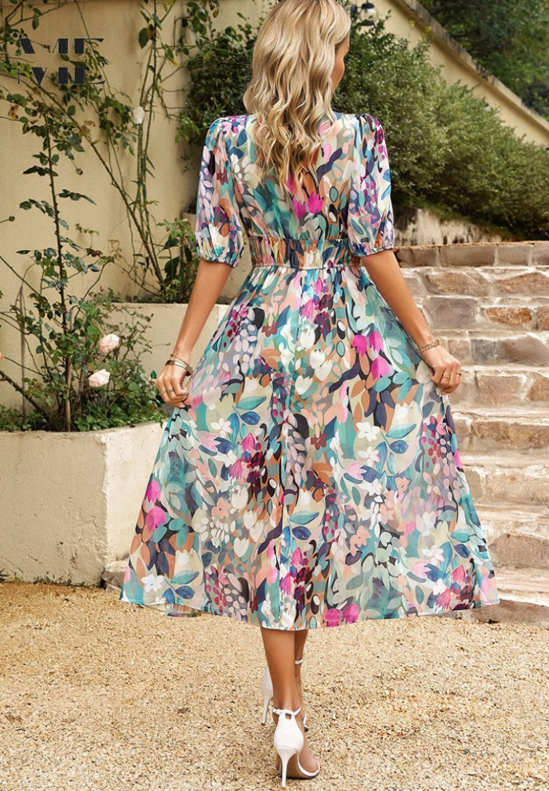 Close-up of abstract print fabric on a women's belted midi dress, versatile style
