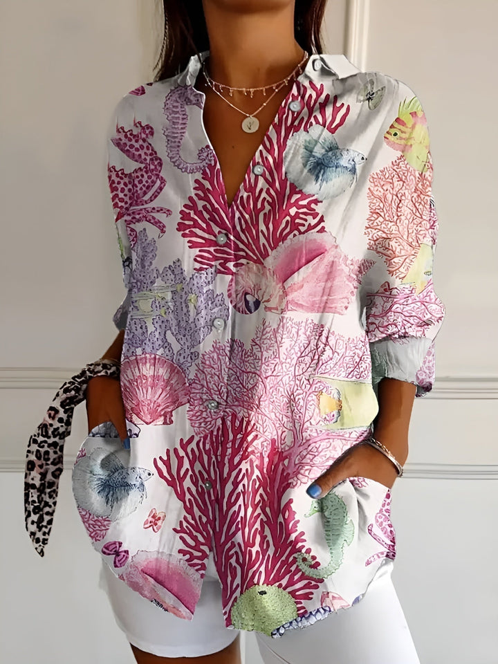 Plus size women's abstract print split-neck blouse, long sleeve. Versatile & elegant for all body types.