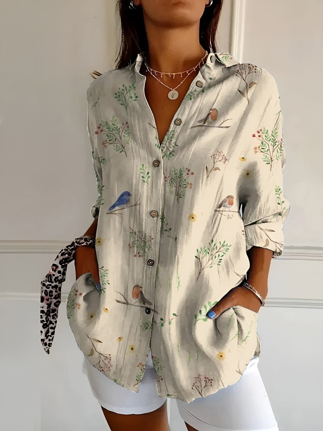 Chic women's abstract print split-neck blouse, long sleeve. A versatile patterned top for fashion-forward women.