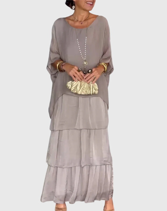 Casual women's flowy tiered maxi dress, featuring a unique abstract print, summer style.