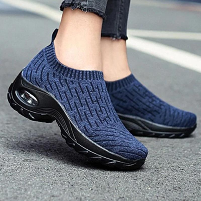 Woman wearing grey Arch Support Comfort Walking Shoes, walking on a path, everyday wear