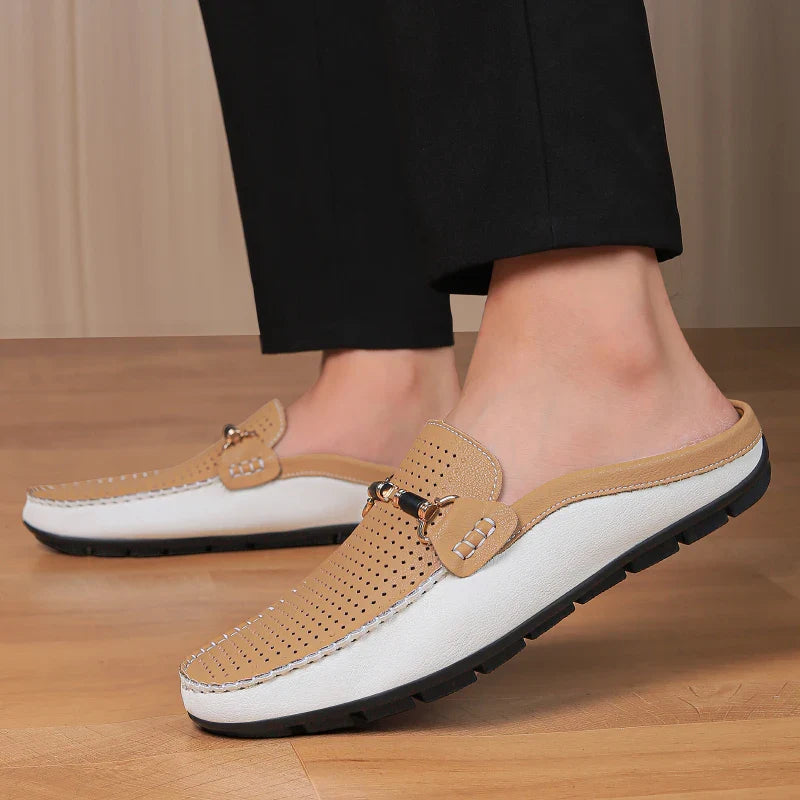 Detail of the comfortable footbed in women's backless perforated leather mules