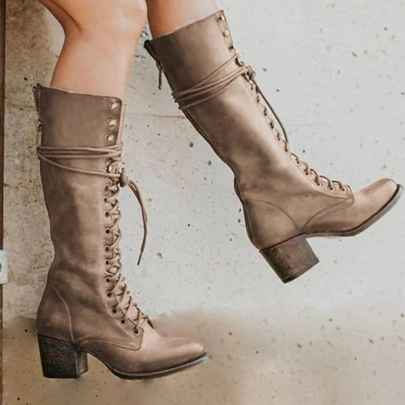 Comfortable women's winter boots, knee-high design, lace-up functionality, and block heel.