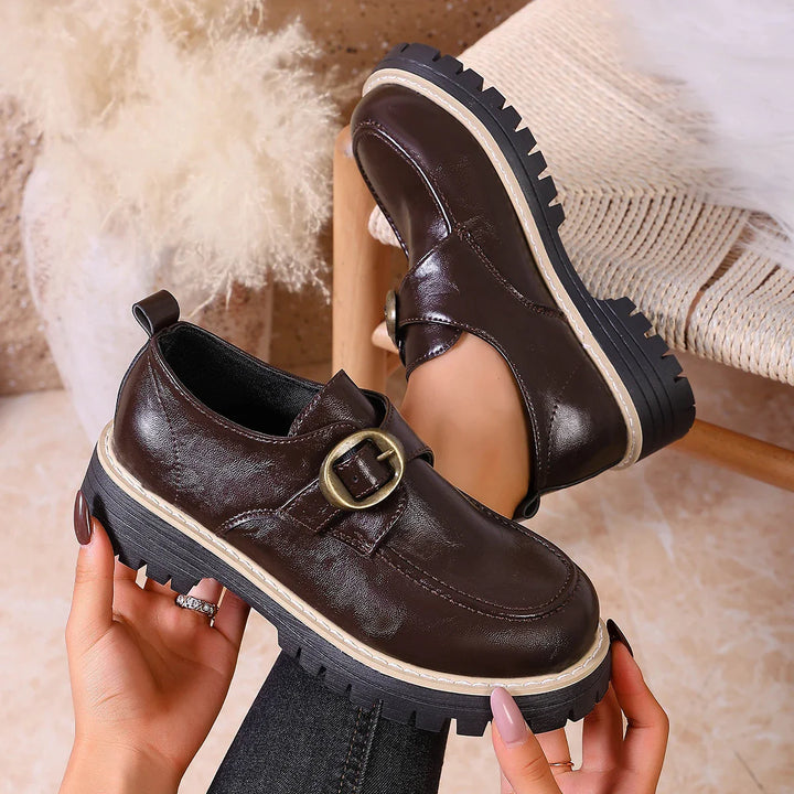 Women's casual buckle leather flats, offering both style and comfort for all-day wear.