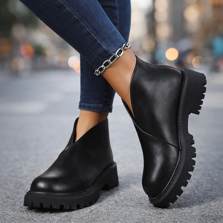 Fashionable women's leather slip-on shoes with a platform sole, stylish everyday footwear.