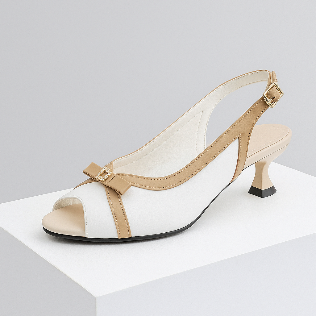 Women's black leather slingback heels with elegant bow detail, sculpted heel. Perfect for dressy occasions.