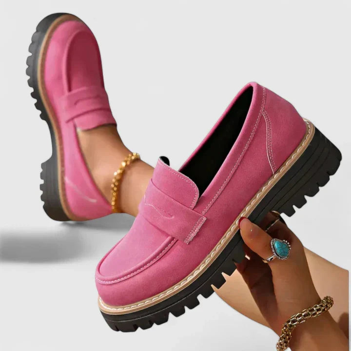 Stylish women's slip-on orthopedic loafers in soft leather, offering superior arch support for walking.