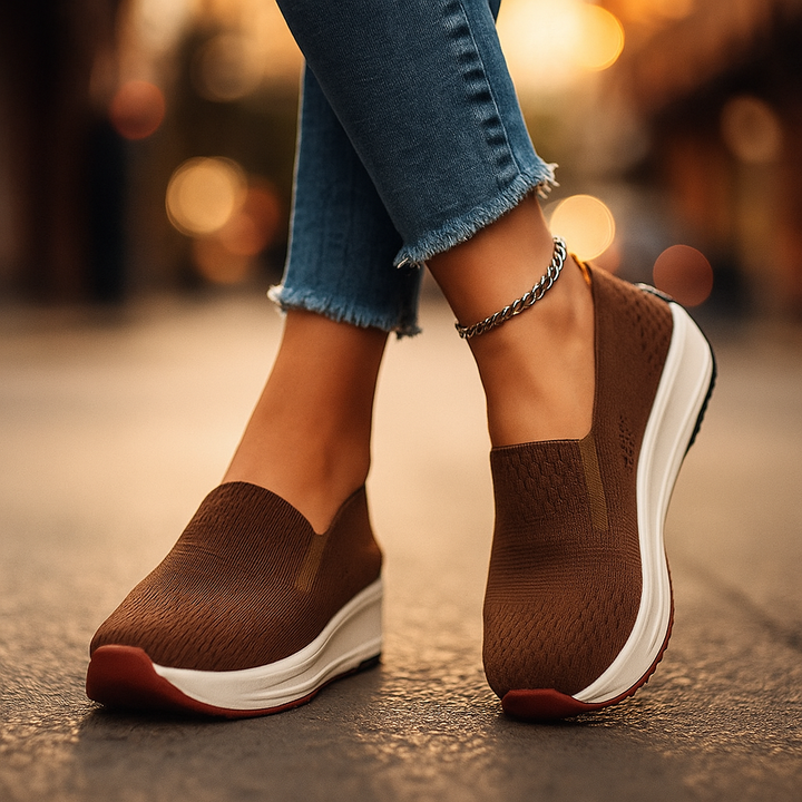 Pair of women's pink orthopedic slip-on walking shoes, ideal for everyday comfort, athletic style