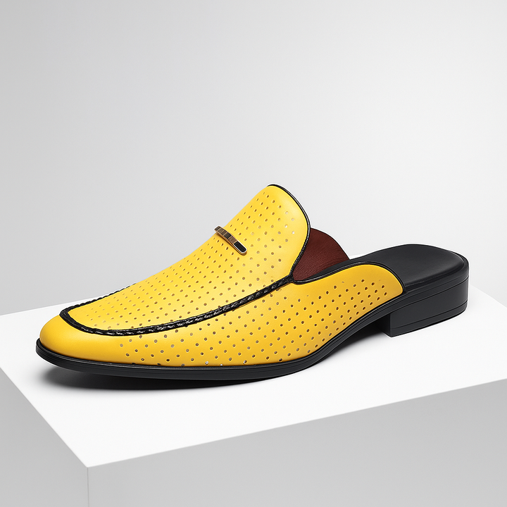 Pair of elegant women's slip-on mules made of soft, perforated brown leather