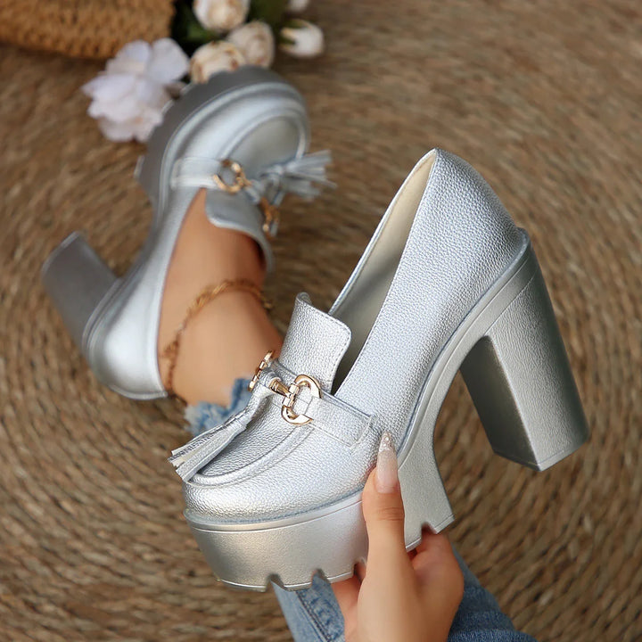Back view of women's platform chunky heel loafers, emphasizing the sturdy and fashionable block heel.