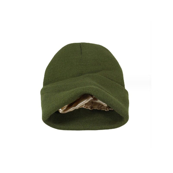 A stack of colorful satin-lined beanies for women, each hair protective and anti-frizz