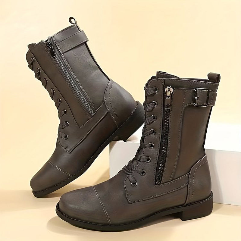 Close-up of side-zip closure on women's combat boots, durable and edgy