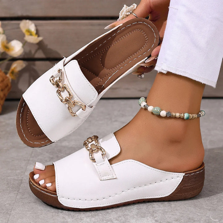 Women's black slide sandals with gold chain detail, perfect for summer casual wear